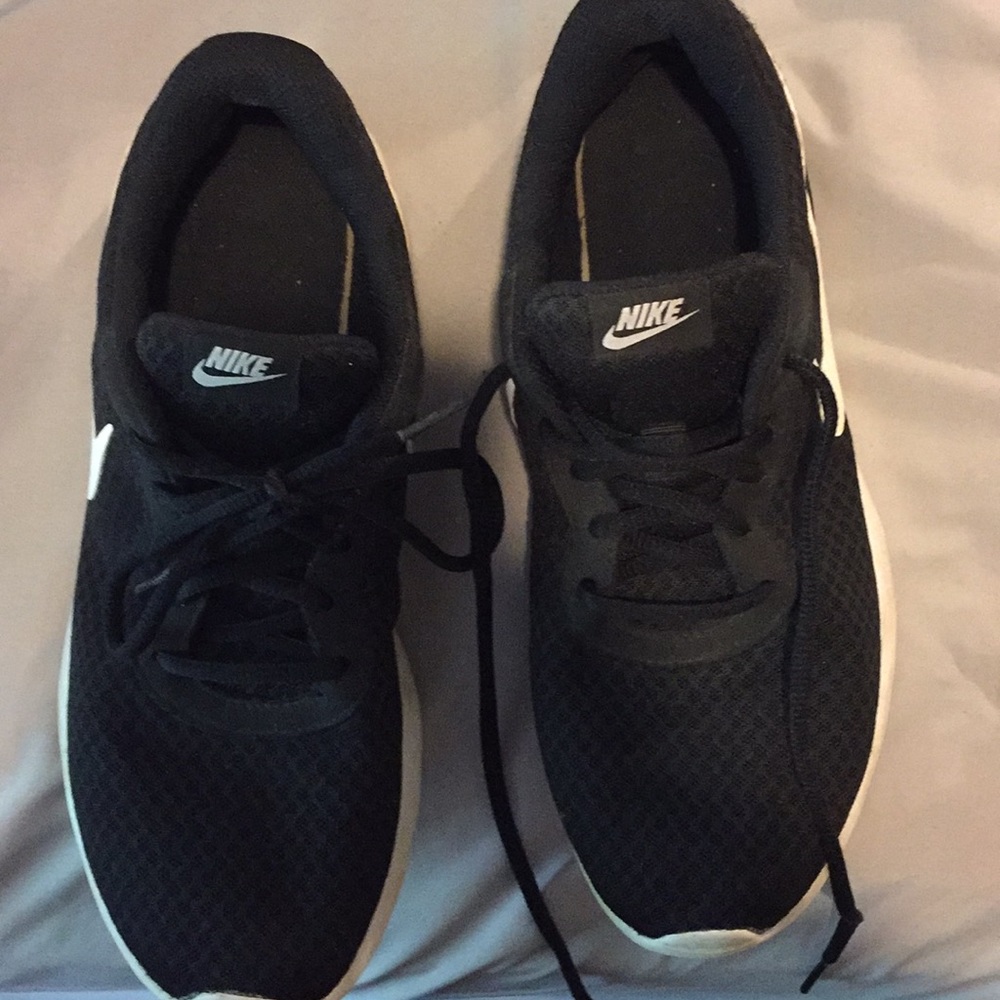 Worn Nike tennis shoes.
